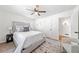 Bright bedroom with a comfortable bed, area rug, ceiling fan and natural light at 801 N Evelyn Nw, Atlanta, GA 30318