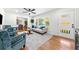 Bright living room with a large window, stylish decor, and hardwood flooring at 801 N Evelyn Nw, Atlanta, GA 30318