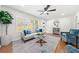 Sunlit living room with hardwood floors, neutral colors, and a cozy seating area at 801 N Evelyn Nw, Atlanta, GA 30318