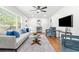 Bright living room with hardwood floors, a ceiling fan, and stylish furnishings at 801 N Evelyn Nw, Atlanta, GA 30318