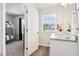 Bright bathroom with granite vanity, window, and view into a bunk room; perfect for ! at 11837 Rizvan Pl, Covington, GA 30014