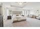 Large main bedroom featuring a tray ceiling, carpet, and a sitting area at 11837 Rizvan Pl, Covington, GA 30014