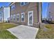 The backyard features a concrete patio, lawn, and an exterior view of the home's siding and windows at 3928 Hester St, Duluth, GA 30097