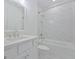 Bright bathroom featuring a tub and shower combination and marble floors at 3928 Hester St, Duluth, GA 30097