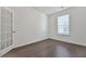 Small bedroom with a window and french doors at 3928 Hester St, Duluth, GA 30097