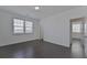 Bedroom featuring wood floors and natural light from two windows at 3928 Hester St, Duluth, GA 30097