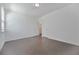 A spacious bedroom with hardwood floors, white walls, and plenty of natural light at 3928 Hester St, Duluth, GA 30097