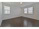 Bedroom with hardwood floors and natural light from two windows at 3928 Hester St, Duluth, GA 30097