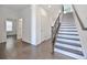 Bright entryway with hardwood floors, staircase, and access to other rooms at 3928 Hester St, Duluth, GA 30097