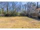 Large backyard with a wooden deck and plenty of grassy area at 6050 Randy Ln, Ellenwood, GA 30294