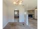 Open-concept view of a dining area and living room space at 6050 Randy Ln, Ellenwood, GA 30294