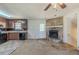 Cozy living room with a fireplace, adjacent to a functional kitchen space at 6050 Randy Ln, Ellenwood, GA 30294