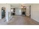 Open-concept living room flowing into the kitchen with a charming stone fireplace at 6050 Randy Ln, Ellenwood, GA 30294