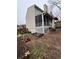 Cozy screened-in porch and backyard featuring a lush garden and well-kept lawn at 1672 Cedar Bluff Way, Marietta, GA 30062