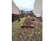 Backyard features raised garden beds and ample space for gardening and outdoor enjoyment at 1672 Cedar Bluff Way, Marietta, GA 30062
