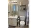 Bright bathroom with a vanity, mirror, and shelves for toiletries at 1672 Cedar Bluff Way, Marietta, GA 30062