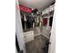 Walk-in closet with wire shelving, hanging clothes, and storage bins at 1672 Cedar Bluff Way, Marietta, GA 30062