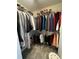 Walk-in closet with wire shelving and hanging clothes for storage at 1672 Cedar Bluff Way, Marietta, GA 30062