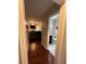 Hallway view of a powder room and living room with hardwood floors at 1672 Cedar Bluff Way, Marietta, GA 30062