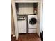 Convenient laundry closet with modern washer, dryer, and cabinet storage at 1672 Cedar Bluff Way, Marietta, GA 30062