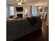 Cozy living room features a ceiling fan and dining area with natural light at 1672 Cedar Bluff Way, Marietta, GA 30062