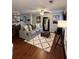 Comfortable living room featuring a plush sofa, fireplace, and contemporary decor at 1672 Cedar Bluff Way, Marietta, GA 30062