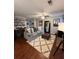 Cozy living room with plush gray sofa, fireplace, and modern decor touches at 1672 Cedar Bluff Way, Marietta, GA 30062