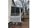 Cozy screened-in patio offers a relaxing outdoor living space with access to the backyard at 1672 Cedar Bluff Way, Marietta, GA 30062