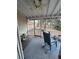 Charming screened porch with a rocking chair and views of the wooded backyard at 1672 Cedar Bluff Way, Marietta, GA 30062