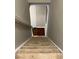 Carpeted staircase leading downstairs to hardwood floors at 1672 Cedar Bluff Way, Marietta, GA 30062