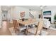 Open concept dining area leading to living space and stairs, with stylish decor and natural light at 11102 Suria Dr, Covington, GA 30014