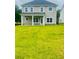 Spacious backyard with a covered patio, perfect for outdoor entertaining and relaxation at 11102 Suria Dr, Covington, GA 30014