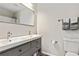 Clean bathroom featuring double vanity, a large mirror, and modern fixtures, offering both style and functionality at 2376 Wellington Cir, Lithonia, GA 30058