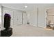 Spacious bedroom with carpet, a ceiling fan, ensuite bathroom, and multiple closets at 2376 Wellington Cir, Lithonia, GA 30058