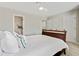Bright bedroom featuring a queen-sized bed, ceiling fan, and en-suite bathroom at 2376 Wellington Cir, Lithonia, GA 30058