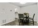 Dining room with wood floors, a ceiling light, and a four-chair table at 2376 Wellington Cir, Lithonia, GA 30058