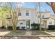 Charming two-story townhome with a welcoming front porch and mature landscaping creating an inviting curb appeal at 2376 Wellington Cir, Lithonia, GA 30058