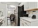 Bright kitchen with stainless steel appliances, white cabinetry, and modern countertops at 2376 Wellington Cir, Lithonia, GA 30058