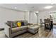 Cozy living area featuring stylish seating, contemporary decor, and an open layout connected to the dining space at 2376 Wellington Cir, Lithonia, GA 30058