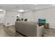 Spacious living area boasting sleek floors, comfortable seating, and an open connection to other living spaces at 2376 Wellington Cir, Lithonia, GA 30058