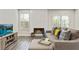 Cozy living room features a fireplace, couch, and a flatscreen TV at 2376 Wellington Cir, Lithonia, GA 30058