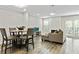 Bright and open living space featuring a dining area, modern fireplace, and stylish furniture arrangements at 2376 Wellington Cir, Lithonia, GA 30058