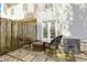 Cozy backyard patio with a seating area, French doors, and an air conditioner unit at 2376 Wellington Cir, Lithonia, GA 30058