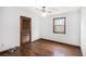 Bedroom featuring hardwood floors, neutral walls, and a window offering natural light at 804 Allatoona Crst, Woodstock, GA 30189