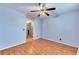 Bedroom featuring wood flooring, a ceiling fan, and closet space at 1029 Daventry Xing, Woodstock, GA 30188