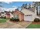 Lovely home featuring a brick facade and attached garage, nestled in a cozy neighborhood at 1029 Daventry Xing, Woodstock, GA 30188