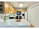 Well-lit kitchen with modern appliances, light wood cabinets, and a functional layout at 1029 Daventry Xing, Woodstock, GA 30188