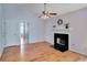 Living room featuring hardwood floors, a fireplace, and several doorways at 1029 Daventry Xing, Woodstock, GA 30188