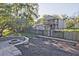 Fenced backyard with a fire pit and a mulched area, creating an inviting outdoor space at 179 South Se Ave, Atlanta, GA 30315