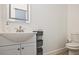 Well-lit bathroom features a classic vanity with storage and modern fixtures at 179 South Se Ave, Atlanta, GA 30315